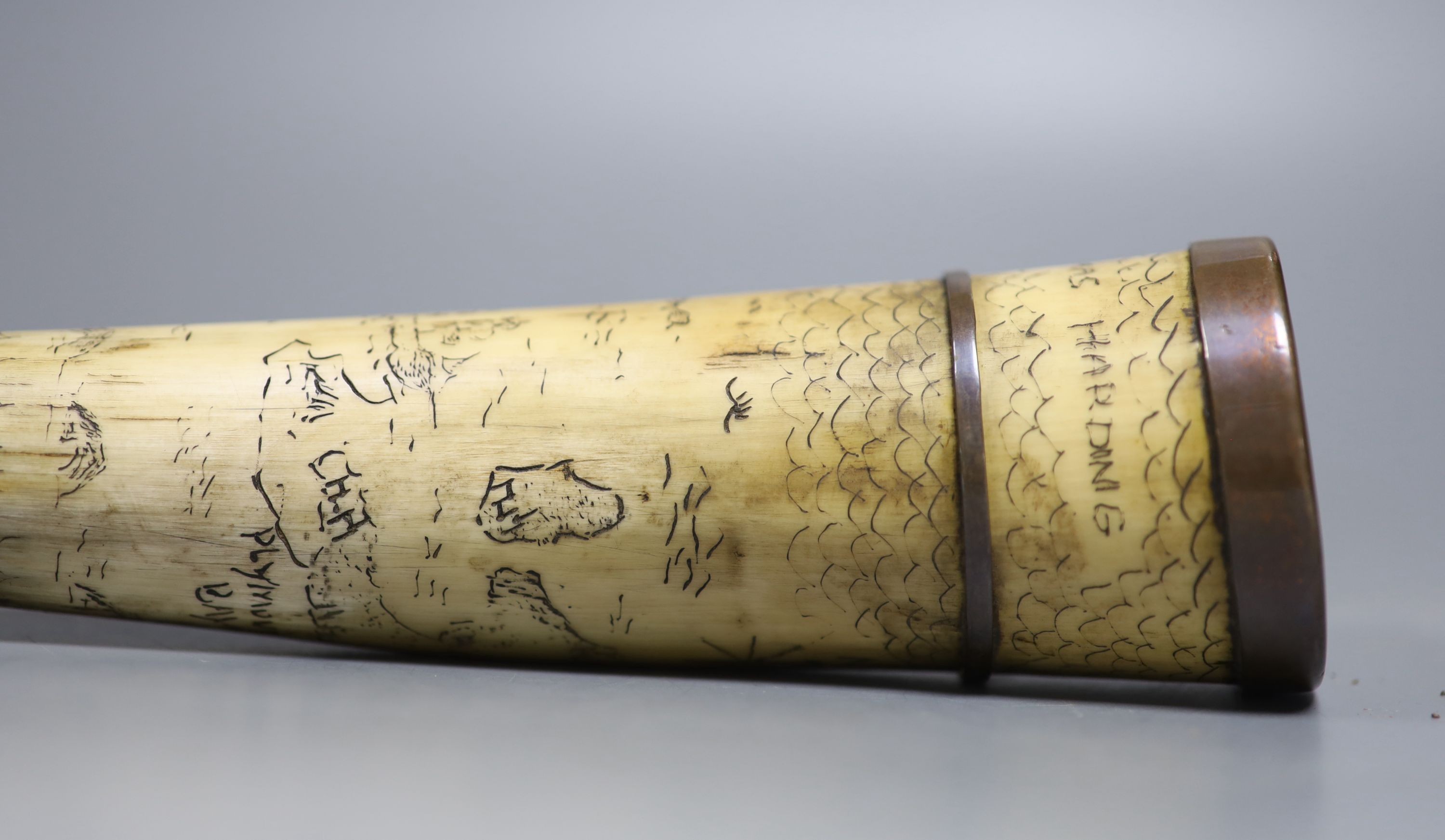 A scrimshaw horn beaker, bearing date 1837, 28cm